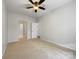 Spacious bedroom with ceiling fan and access to bathroom at 24589 Blue Heron Cir, Lancaster, SC 29720