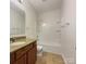 Clean bathroom with a shower/tub combo and granite vanity at 24589 Blue Heron Cir, Lancaster, SC 29720
