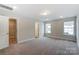 Bright bedroom with neutral walls and carpet at 6280 Culbert St # 190, Harrisburg, NC 28075
