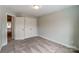 Well-lit bedroom featuring carpet and double closets at 6280 Culbert St # 190, Harrisburg, NC 28075