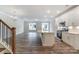 Modern kitchen with white cabinets, quartz countertops, and island at 6280 Culbert St # 190, Harrisburg, NC 28075