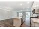 Modern kitchen with white cabinets, stainless steel appliances, and an island at 6280 Culbert St # 190, Harrisburg, NC 28075