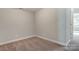 Bright bedroom featuring neutral walls and carpet at 6280 Culbert St # 190, Harrisburg, NC 28075