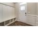 Entryway with built-in bench, storage, and hardwood floors at 6280 Culbert St # 190, Harrisburg, NC 28075