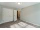 Spacious bedroom with double doors leading to a bathroom at 6280 Culbert St # 190, Harrisburg, NC 28075