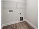 Laundry room with vinyl flooring and shelving at 6280 Culbert St # 190, Harrisburg, NC 28075
