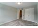 Spacious bedroom with double doors and access to hallway at 6280 Culbert St # 190, Harrisburg, NC 28075