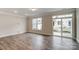 Bright living room with hardwood floors and sliding glass doors at 6280 Culbert St # 190, Harrisburg, NC 28075