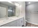 Bathroom with double vanity, marble shower, and separate tub at 6280 Culbert St # 190, Harrisburg, NC 28075
