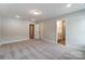 Bright bedroom with carpet, neutral walls, and ensuite access at 6280 Culbert St # 190, Harrisburg, NC 28075