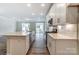 Bright kitchen featuring white cabinets, quartz countertops, and stainless steel appliances at 6280 Culbert St # 190, Harrisburg, NC 28075