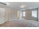 Spacious bedroom with neutral walls, carpet and ensuite bathroom at 6280 Culbert St # 190, Harrisburg, NC 28075