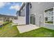 Private backyard with patio and grassy area at 6280 Culbert St # 190, Harrisburg, NC 28075