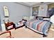 Bedroom with two beds, nightstand, and plenty of light at 9841 Baxter Caldwell Dr, Charlotte, NC 28213