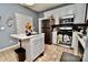 Kitchen with stainless steel appliances and an island at 9841 Baxter Caldwell Dr, Charlotte, NC 28213
