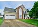 Two-story house with a two-car garage and brick facade at 9841 Baxter Caldwell Dr, Charlotte, NC 28213