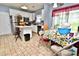 Kitchen with island, dining area, and access to backyard at 9841 Baxter Caldwell Dr, Charlotte, NC 28213