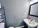 Small bathroom with single sink and mirrored medicine cabinet at 9841 Baxter Caldwell Dr, Charlotte, NC 28213