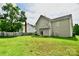 Spacious backyard with a large grassy area and wooden fence at 9841 Baxter Caldwell Dr, Charlotte, NC 28213