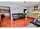 Living room with hardwood floors and views to other rooms at 9841 Baxter Caldwell Dr, Charlotte, NC 28213