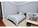 Bedroom with double bed and crib at 9841 Baxter Caldwell Dr, Charlotte, NC 28213