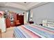 Bedroom with striped bedspread and ample closet space at 9841 Baxter Caldwell Dr, Charlotte, NC 28213