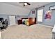 Bedroom with a bed, desk, and ceiling fan at 9841 Baxter Caldwell Dr, Charlotte, NC 28213