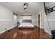 Main bedroom with hardwood floors and ceiling fan at 1820 Oakdale Green Dr, Charlotte, NC 28216