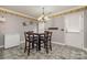 Kitchen dining area with table and four chairs at 1820 Oakdale Green Dr, Charlotte, NC 28216