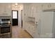 Kitchen boasts white cabinets, stainless steel appliances, and granite countertops at 2819 Royal Ridge Ln, Charlotte, NC 28212