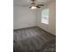 Spacious bedroom with ceiling fan and neutral carpeting at 2819 Royal Ridge Ln, Charlotte, NC 28212