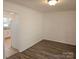 Simple dining room with wood-look flooring and access to the kitchen at 2819 Royal Ridge Ln, Charlotte, NC 28212