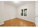 Simple bedroom with hardwood floors and a window at 11 Shipmaster Ct, Clover, SC 29710