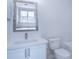 Bathroom with white vanity, quartz countertop and frameless mirror at 12914 Mosby Ln, Charlotte, NC 28273
