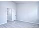 Spacious bedroom with door to hallway and loft-style ceiling at 12914 Mosby Ln, Charlotte, NC 28273