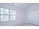 Bright bedroom with large window and double doors leading to a closet at 12914 Mosby Ln, Charlotte, NC 28273