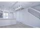 Open concept dining area with modern light fixture and hardwood floors at 12914 Mosby Ln, Charlotte, NC 28273