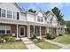 Brick townhouses with updated landscaping and inviting front porches at 12914 Mosby Ln, Charlotte, NC 28273