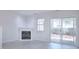 Living room featuring a fireplace and sliding glass doors to backyard at 12914 Mosby Ln, Charlotte, NC 28273