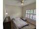 Bright bedroom with window shutters, ceiling fan, and ample natural light at 5916 Meadowmere Dr, Monroe, NC 28110