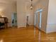 Bright and spacious entryway with hardwood floors and coat rack at 5916 Meadowmere Dr, Monroe, NC 28110