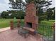 Relaxing outdoor brick fireplace and patio area at 5916 Meadowmere Dr, Monroe, NC 28110
