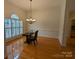 Formal dining room with hardwood floors and a chandelier at 5916 Meadowmere Dr, Monroe, NC 28110