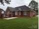 Brick house with a large backyard and patio at 5916 Meadowmere Dr, Monroe, NC 28110