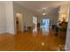 Spacious living room with hardwood floors, fireplace and sunroom access at 5916 Meadowmere Dr, Monroe, NC 28110