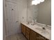 Double vanity bathroom with tiled floor and a shower at 5916 Meadowmere Dr, Monroe, NC 28110