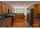 Kitchen with stainless steel appliances and hardwood floors at 5916 Meadowmere Dr, Monroe, NC 28110