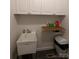 Laundry room with cabinets and utility sink at 5916 Meadowmere Dr, Monroe, NC 28110