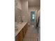 Double vanity bathroom with tiled floor and shower at 5916 Meadowmere Dr, Monroe, NC 28110