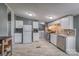 Updated kitchen with white cabinets, stainless steel appliances, and tile flooring at 707 Cool Spring Rd, Statesville, NC 28625